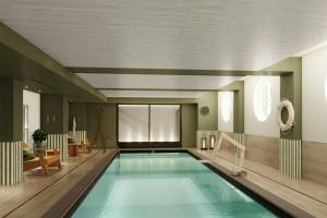 a large swimming pool in a hotel room at The Harborvale, Autograph Collection in Burlington
