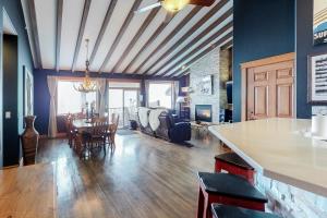 a dining room and living room with a dining table at Tree Tops 15 in Big White