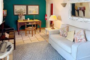 a living room with a couch and a table at Harmonie in Rivière Noire