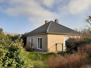 a small brick house with a roof at Maison Belle Vue Ronse in Ronse