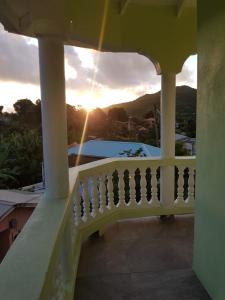 a view of the sunset from the balcony of a house at Country Green in La Feuillet