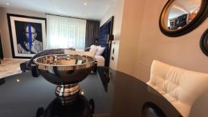 a room with a table with a bowl on it at Moulin Royale in Saint-Etienne-Roilaye