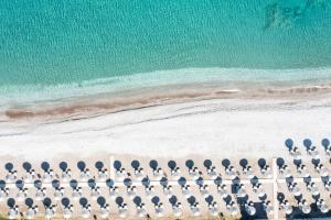 an overhead view of a beach with chairs and the ocean at Sheraton Rhodes Resort in Ixia