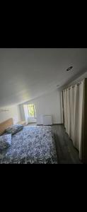 a bedroom with a bed and a window at Maison de la passerelle in Parthenay