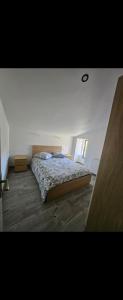 a bedroom with a bed in the middle of the room at Maison de la passerelle in Parthenay