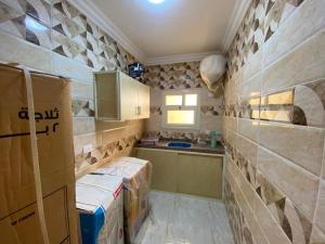 a kitchen with boxes on the walls of a room at Adamora Stay in Marsa Alam City +34 photos