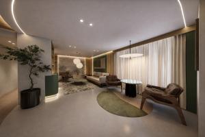 a living room with a couch and a table at Hospedium GL Hotel Andújar in Andújar +1 photo