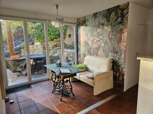 a living room with a couch and a table at Casa Conte in Orselina