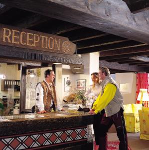 a group of men standing around a counter in a restaurant at Das Lafairs in Pfunds +38 photos