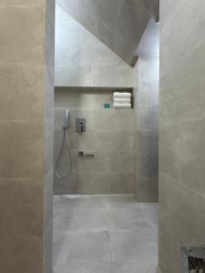 a bathroom with a shower with a sink and a shower at Luxe House Odessa Private Jacuzzi BBQ, Free Parking in Odesa +25 photos
