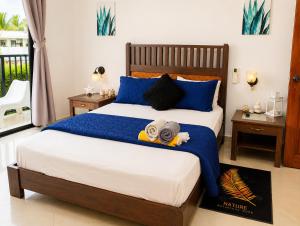 a bedroom with a bed with a teddy bear on it at Best View 2 Adults Only in La Laguna