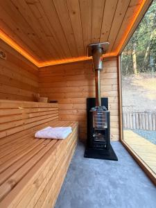 a inside of a sauna with a stove in it at Lune Dunakanyar in Esztergom