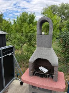 a stone oven sitting on the back of a truck at Sunset Villa Balatonfenyves in Balatonfenyves