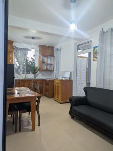 a living room with a table and a couch at New Beginnings in Salisbury
