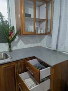 a kitchen with a counter top with a drawer at New Beginnings in Salisbury