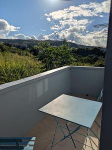 a white table on a balcony with a view at New Beginnings in Salisbury