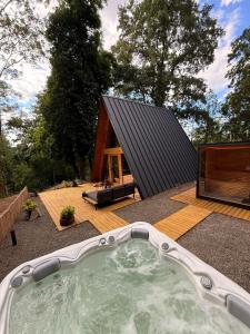 a hot tub in the backyard of a house at Lune Dunakanyar in Esztergom