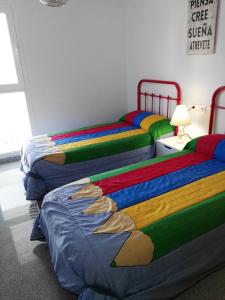 Postel nebo postele na pokoji v ubytování Velez Nazari Cambriles