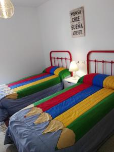 Postel nebo postele na pokoji v ubytování Velez Nazari Cambriles