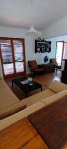 a living room with a couch and a table at Apartmani Šikić Metajna in Metajna