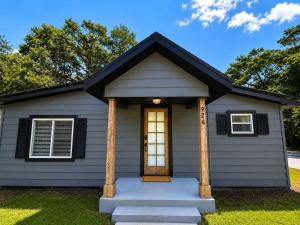 a tiny house with a front door at The Cozy Corner House in Kissimmee