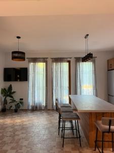 a kitchen with a table and chairs in a room at Terra Kampos Chios in Chios