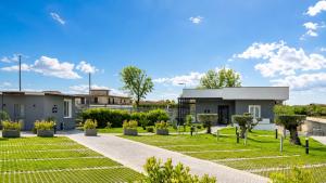 a house with a garden in front of it at Brahma luxury B&B in Marigliano