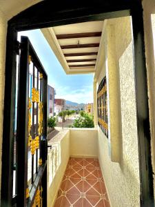 an open door to a balcony with a view at اقامة الابرار in Oued Laou