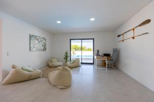 a living room with three bean bags on the floor at Vivenda Vilhegas in Albufeira