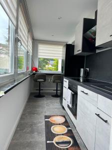 a kitchen with a counter with plates on the floor at Kontinental C in Bad Harzburg