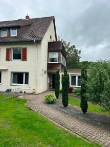 a house with a brick driveway in front of it at Kontinental C in Bad Harzburg