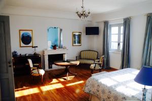 a bedroom with a bed and a table and a fireplace at Il Maniero in Cassino