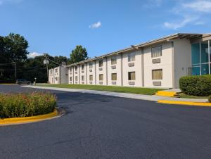 an empty parking lot in front of a building at Forsythia Inn in Forsyth