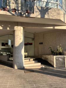a building with stairs and a window and a building at MyN 2 in La Plata