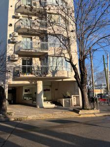 a tall building with a balcony on the side of it at MyN 2 in La Plata