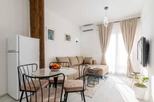 a living room with a table and a couch at Apartmani Oleander in Bar