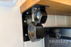 a close up of a door handle on a stove at Sea Farm Stays in Broadstairs