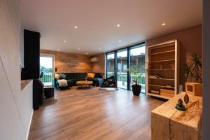 a living room with a couch and a table at Lofoten Green House in Ramberg
