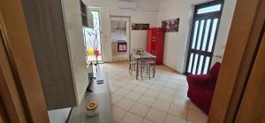 a kitchen with a counter and a table in a room at Petrucci House in Vasto +12 photos