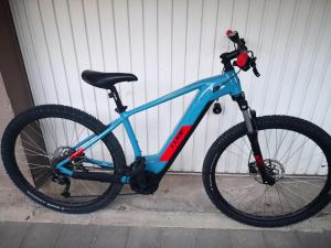 a blue bike parked next to a building at Apartment Riva Lastovo in Ubli