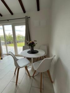 a dining room with a table and two chairs at Villa Noor Visoko in Visoko