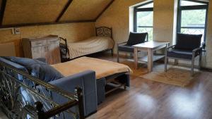a room with a bed and two chairs and a table at Jermuk garden in Kechʼut