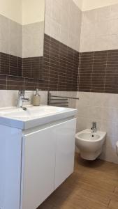 a bathroom with a sink and a toilet at Casa della nonna in Pescara