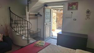 a room with a staircase leading to a door at Villa daniela in Taormina