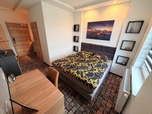 a small room with a bed and a table at Sleep Inn Hotel in Paderborn