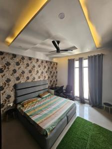 a bedroom with a bed and a couch at The High View in Mohali
