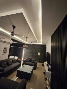 a living room with a couch and a table at The High View in Mohali