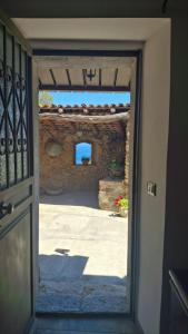 an open door with a view of a patio at Villa daniela in Taormina +6 photos