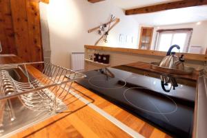 a kitchen with a sink and a dishwasher at Historic Centre Studio, St-André & Bastille view! in Grenoble +5 photos