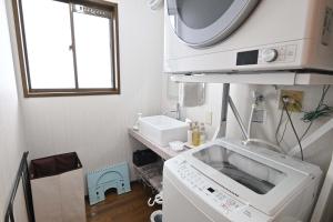 a kitchen with a microwave and a sink at Fuka in Beppu -New Open January2026 in Beppu +63 photos